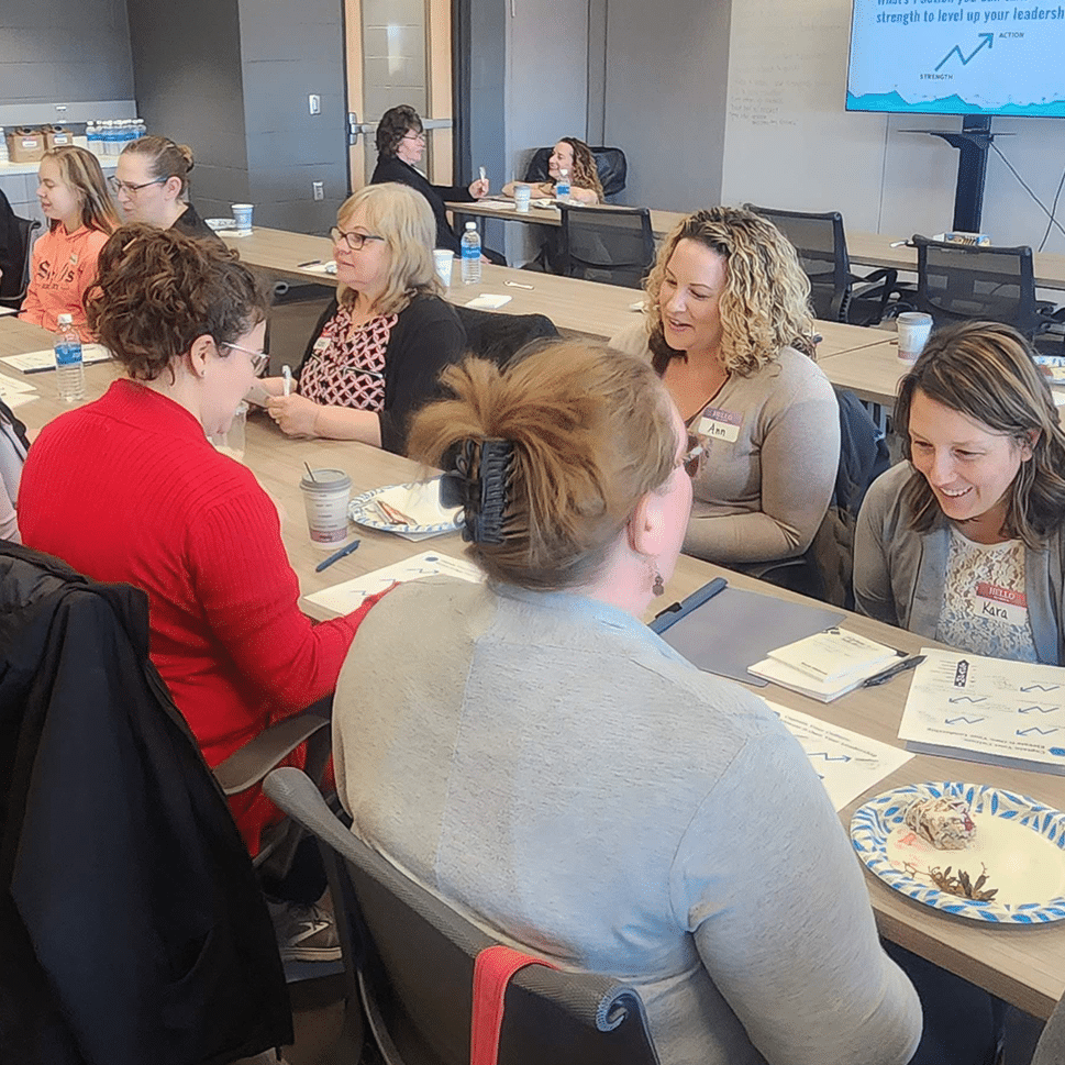 participants engaging at lead with impact course with ann vote